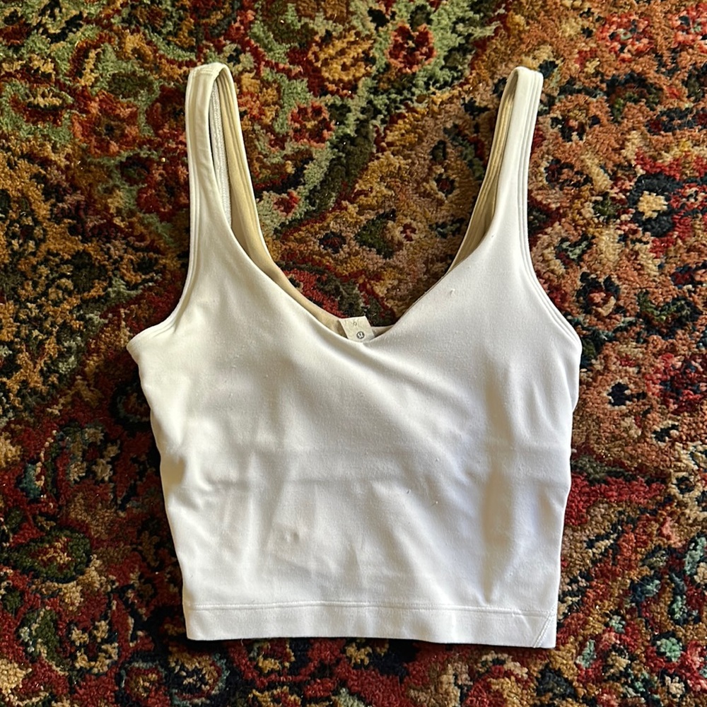 White alight tank ( no pads in the bra area I can find them if wanted )
